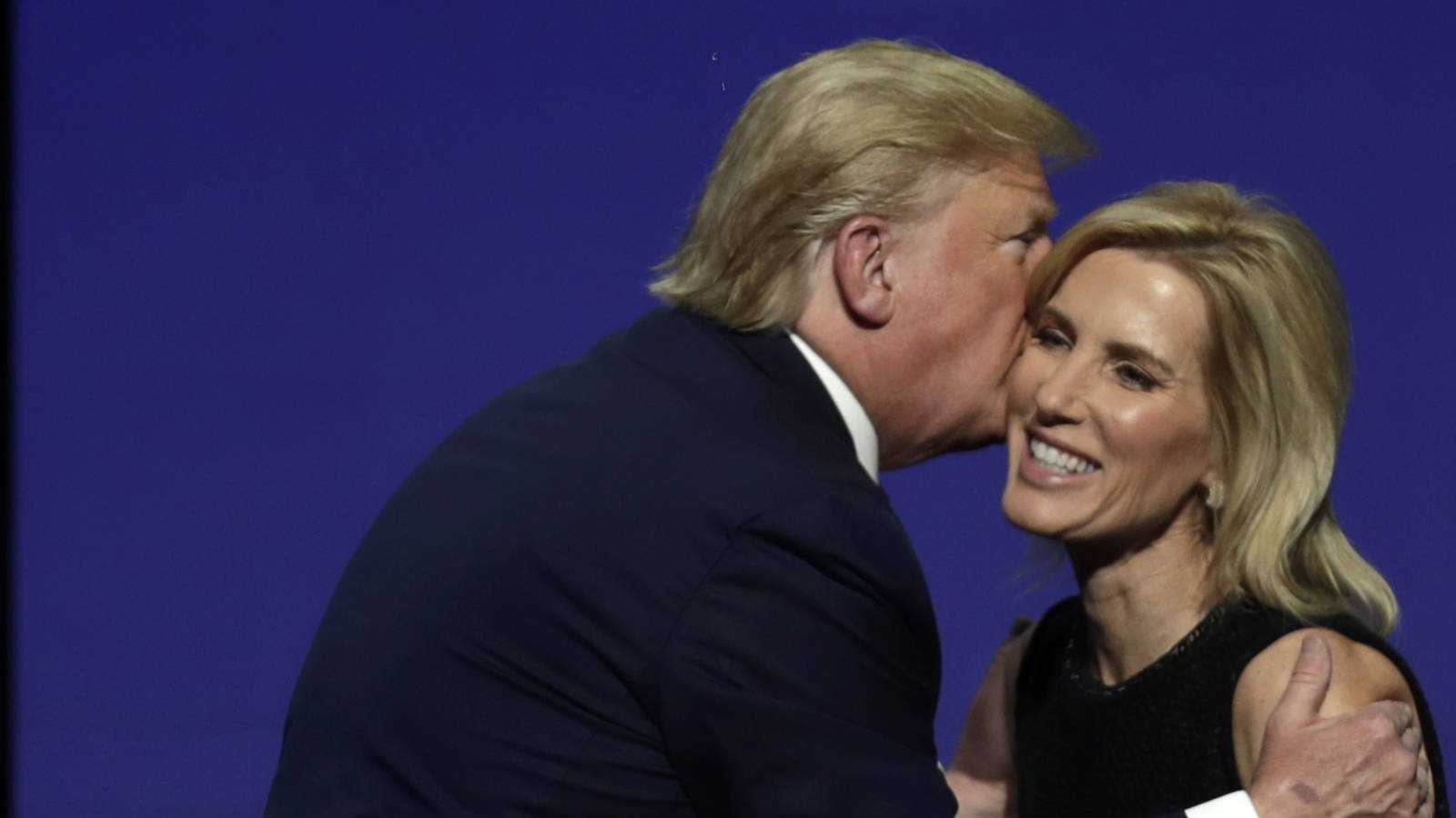 President Donald Trump gives Laura Ingraham a kiss after inviting her on stage during the Turning Point USA Student Action Summit at the Palm Beach County Convention Center, Saturday, Dec. 21, 2019. (c) Sipa AP22410913_000020