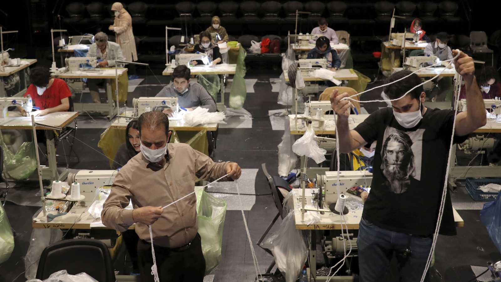 olunteers wearing face masks to curb the spread of the new coronavirus, sew face masks for poor people, at the Hafez theatre hall in downtown Tehran, Iran, Wednesday, April 15, 2020. (c) Sipa AP22447717_000006