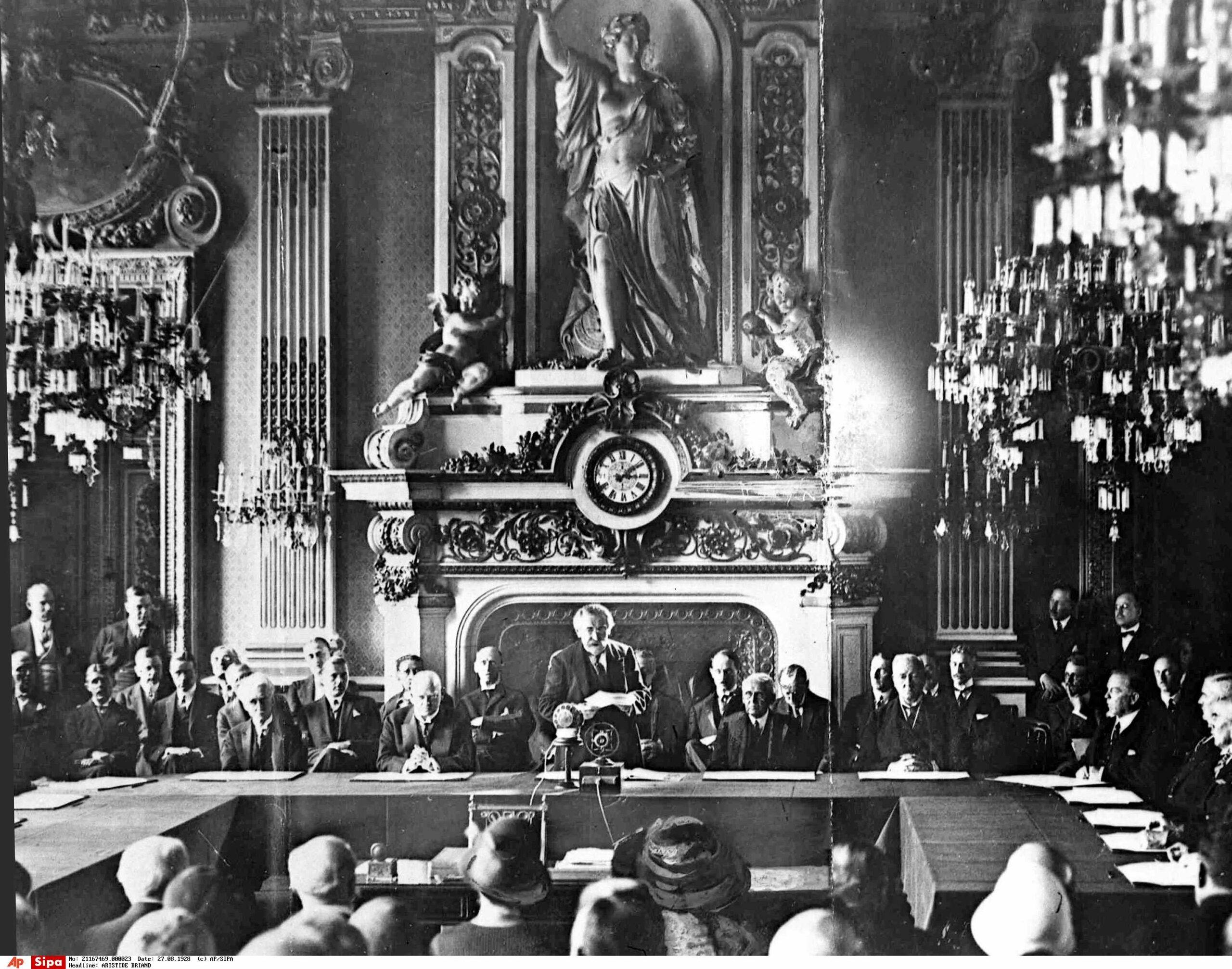 French Foreign Minister Aristide Briand, centre standing, gives his address in the Palais D'Orsay, Paris, Aug. 27, 1928, before the signing of the Pact of Peace The KelloggÐBriand Pact (also called the General Treaty for the Renunciation of War or the World Peace Act) by 15 nations. Seated at table, left to right; Paul Haymans, Belgian Foreign Minister; German Foreign Minister Gustav Stresemann; Briand;  Frank B. Kellogg, American Secretary of State; Lord Ronald Cushendun, Acting Secretary of State for Foreign Affairs for Britain. (AP Photo)/APHSL8218/AP0005/1202071511