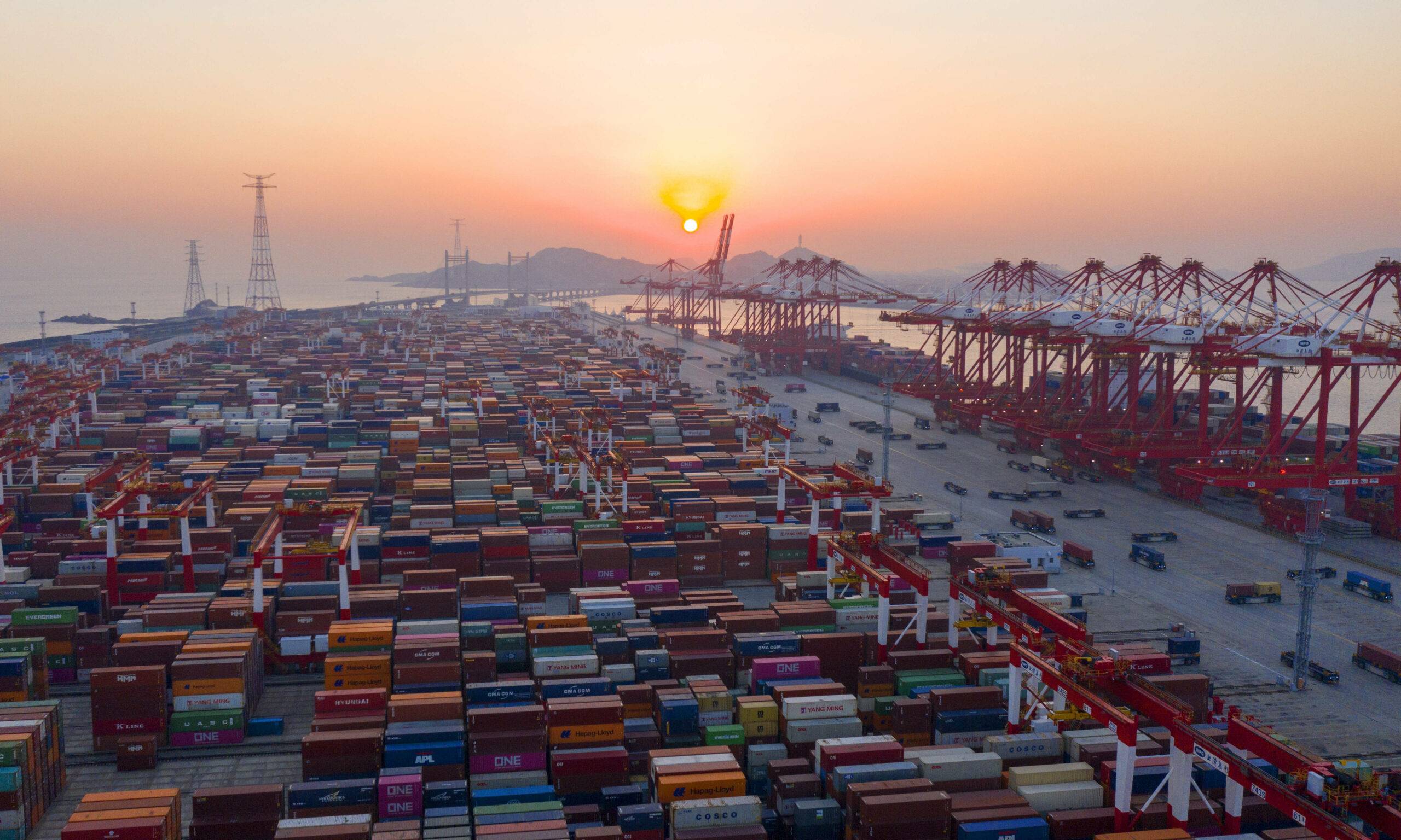SHANGHAI, CHINA - JANUARY 1, 2020 - A number of large container ships are loading and unloading at Yangshan Deepwater Port in Shanghai. Shanghai, China, in the early morning of January 1, 2021. In 2020, the annual container throughput of Shanghai Port ranked first in the world for the 11th consecutive year. (Photo by Lu Hongjie / Costfoto/Sipa USA)/31875271//2101010753