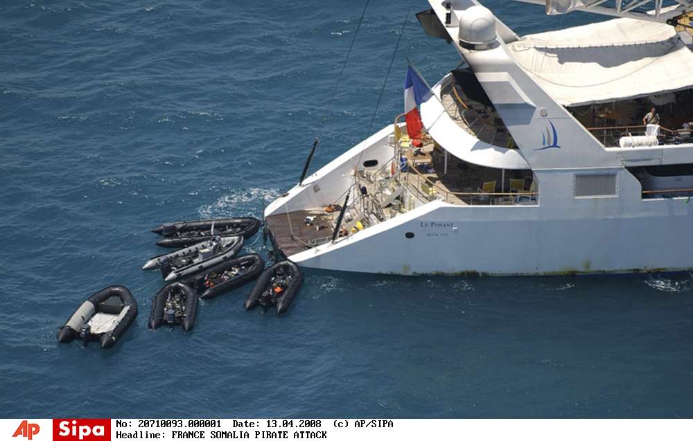 In this image released by the French Defense Ministry Saturday, April 12, 2008, Zodiac commando boats arrive at French cruise ship Le Ponant, off Somalia's coast, Saturday, April 12, 2008. Helicopter-borne French troops have swooped in on Somali pirates after they released 30 hostages from a yacht, seizing six of the pirates and recovering sacks of money, apparently ransom paid by the yacht's owners to win the captives' release. The pirates had boarded the 88-meter (288-foot) French luxury yacht Ponant a week ago, capturing its crew, 22 of whom were French, off the coast of Somalia in the Gulf of Aden. Pirates seized more than two dozen boats off the Somali coast last year, mostly in hopes of securing ransoms. (AP Photo/French Defense Ministry, HO) /FRANCE_SOMALIA_PIRATE_ATTACK_PAR101/IMAGE RELEASED BY THE FRENCH DEFENSE MINISTRY SATURDAY, APRIL 12, 2008 - AP PROVIDES ACCESS TO THIS PUBLICLY DISTRIBUTED HANDOUT PHOTO. THE COPYRIGHT IS OWNED BY A THIRD PARTY./0804131424