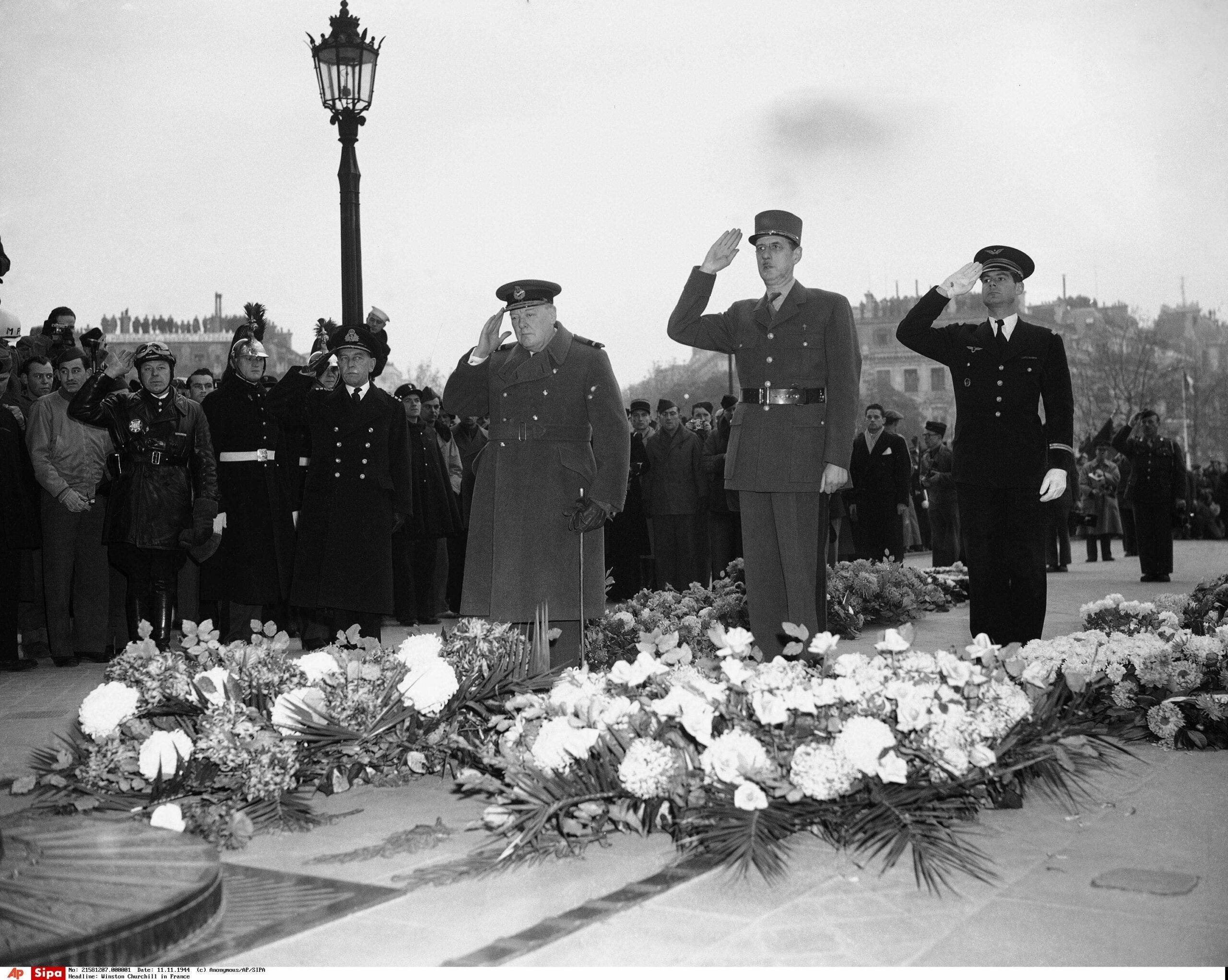 In this image provided by the United States Army Signal Corps, Prime Minister Winston Churchill, and Gen. Charles de Gaulle, French leader, salute as they paid homage to the French unknown soldier during Armistice Day ceremonies in Paris on Nov. 11, 1944. Others in picture not identified. (AP Photo/United States Army Signal Corps)/APHS394255/AP441111191/25299 - AP PROVIDES ACCESS TO THIS PUBLICLY DISTRIBUTED HANDOUT PHOTO PROVIDED BY THE UNITED STATES ARMY SIGNAL CORPS./1406121532