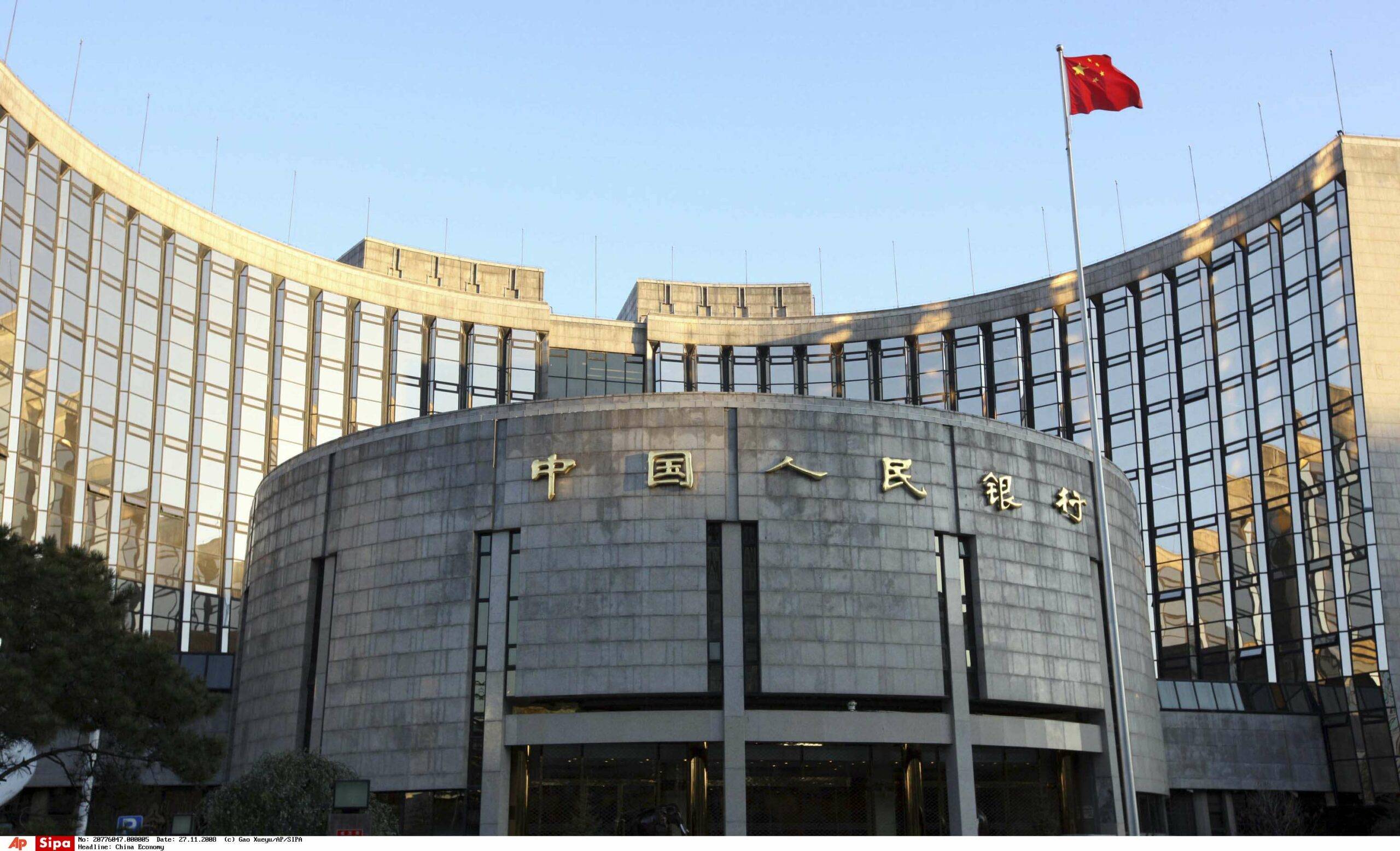 In this photo released by China's Xinhua News Agency, a Chinese flag flutters in front of the headquarters of the People's Bank of China (PBOC) in Beijing on Thursday, Nov. 27, 2008 . The impact of the global financial crisis on China's economy is deepening and a large interest rate cut announced Wednesday by the central bank is essential to boosting slowing growth, the country's top planner said. (AP Photo/Xinhua, Gao Xueyu)/China_Economy_XIN101/0811270921