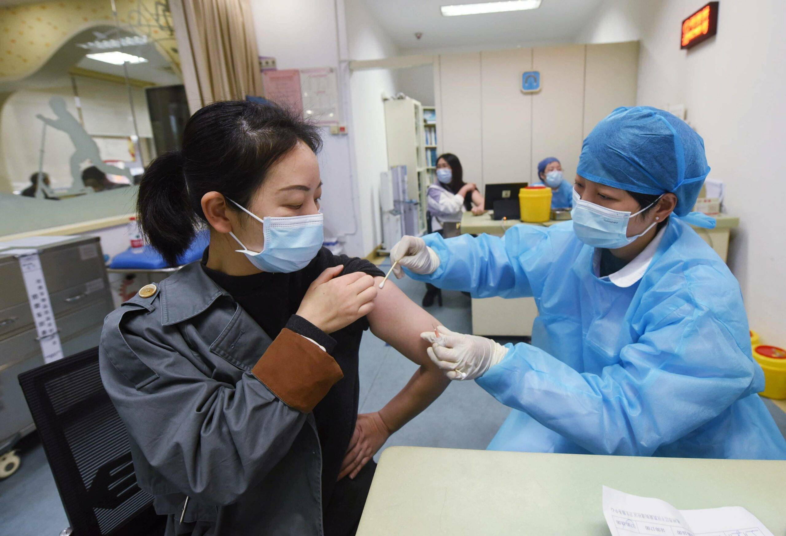 A medical worker inoculates a resident of Hangzhou, Zhejiang province, China, March 28, 2021. According to data released by the National Health Commission, as of March 27, 2021, Sipa USA)/32778802//2103280951