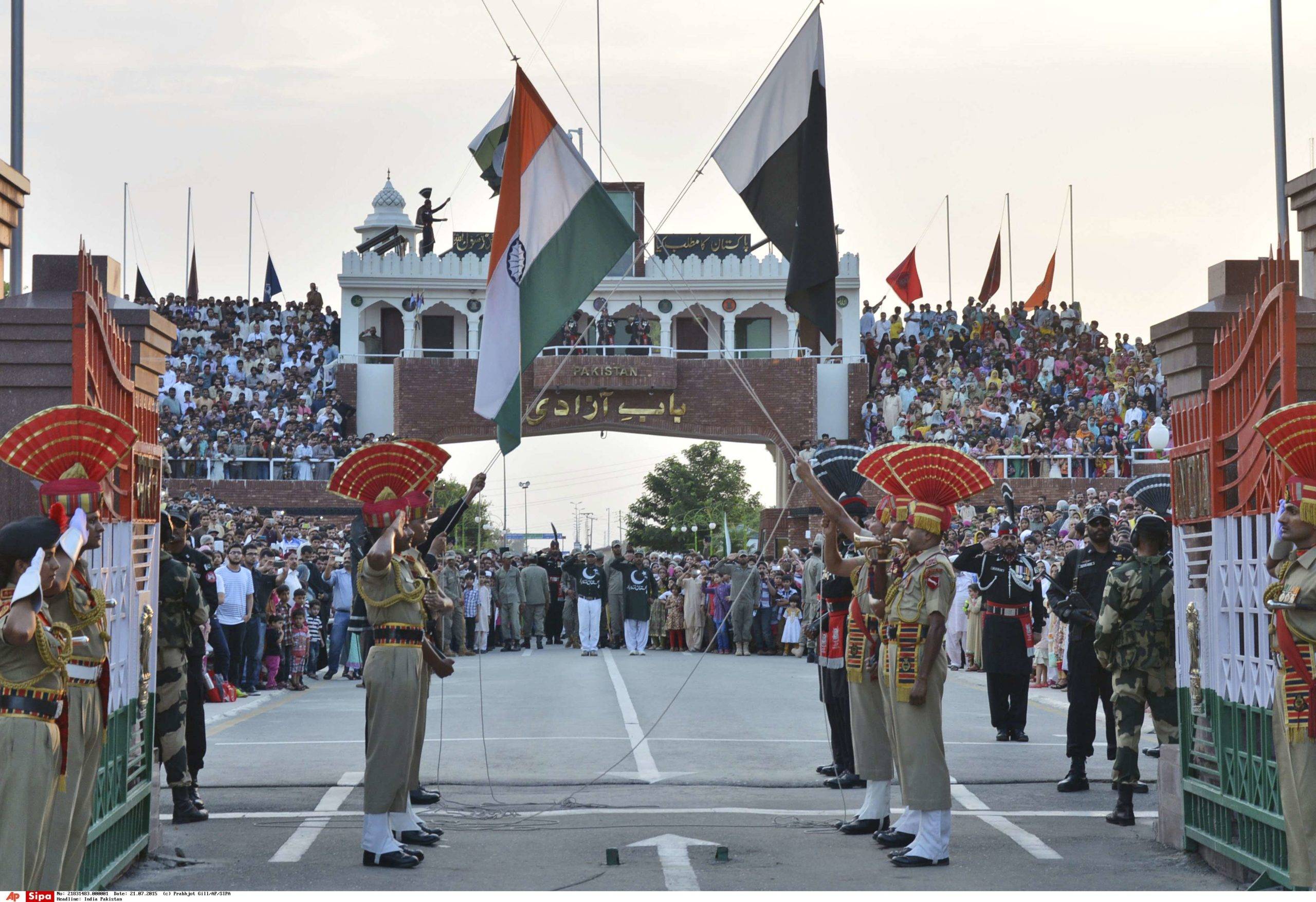 FILE-In this July 21, 2015 file photo, Indian and Pakistani flags are lowered during a daily retreat ceremony at the India-Pakistan joint border check post of Attari-Wagah near Amritsar, India.The top security officials from India and Pakistan held bilateral talks in Thailand's capital on Sunday, signaling a resumption of the rival countries' on-again, off-again peace dialogue.(AP Photo/Prabhjot Gill, file) EDITORIAL USE ONLY/RSI160/175240439390/July 21, 2015 file photo EDITORIAL USE ONLY/1512061522