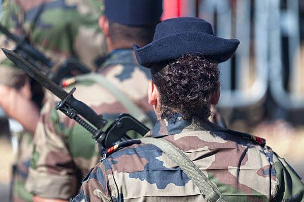 Saint Denis, Reunion - July 14 2016: Female master corporal of the French Army parading during Bastille Day.
