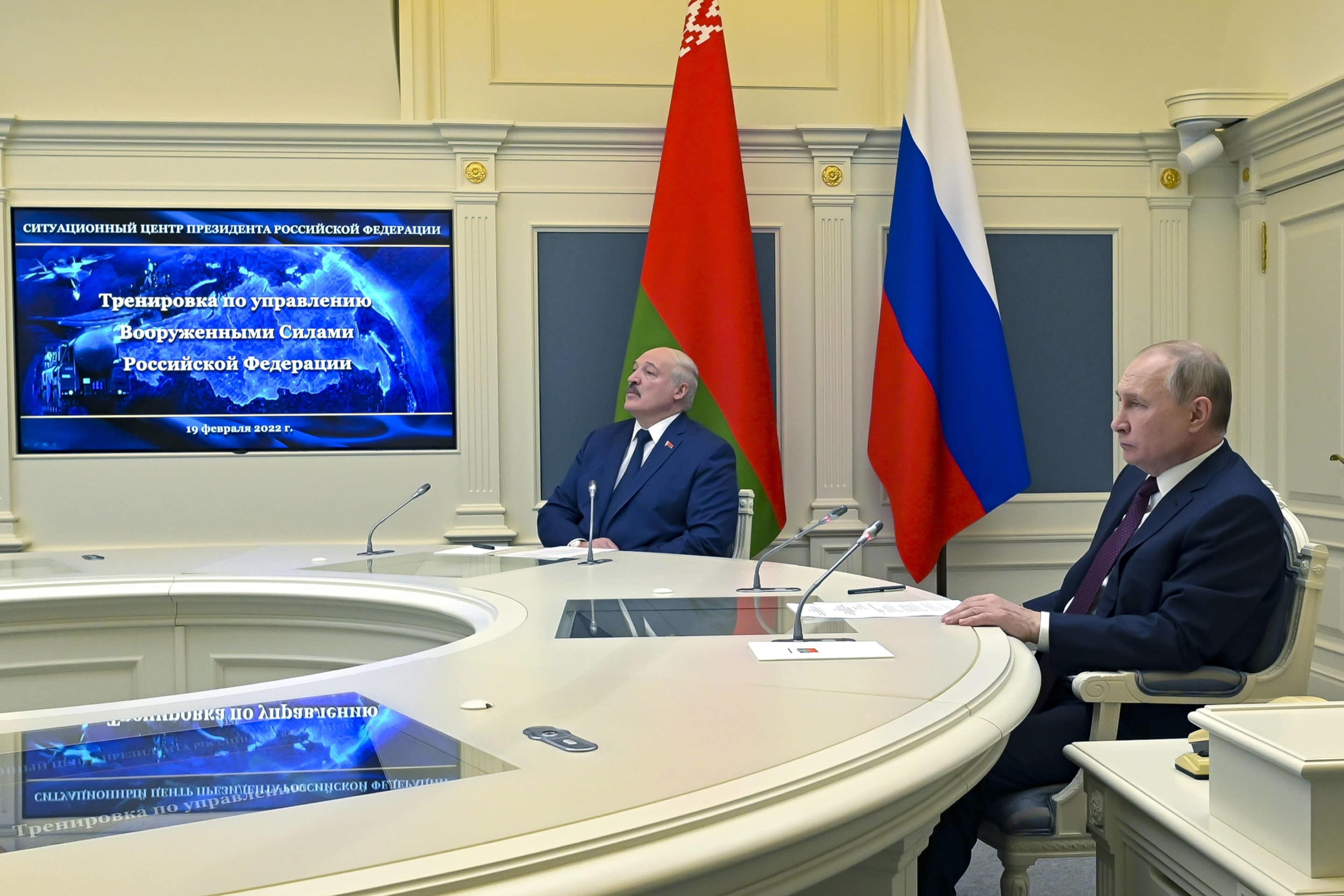 Russian President Vladimir Putin, right, and Belarusian President Alexander Lukashenko watch military drills via videoconference in Moscow, Russia, Saturday, Feb. 19, 2022. Alexei Nikolsky, Sputnik, Kremlin Pool Photo via AP)/XAZ116/22050404085135/POOL PHOTO/2202191225