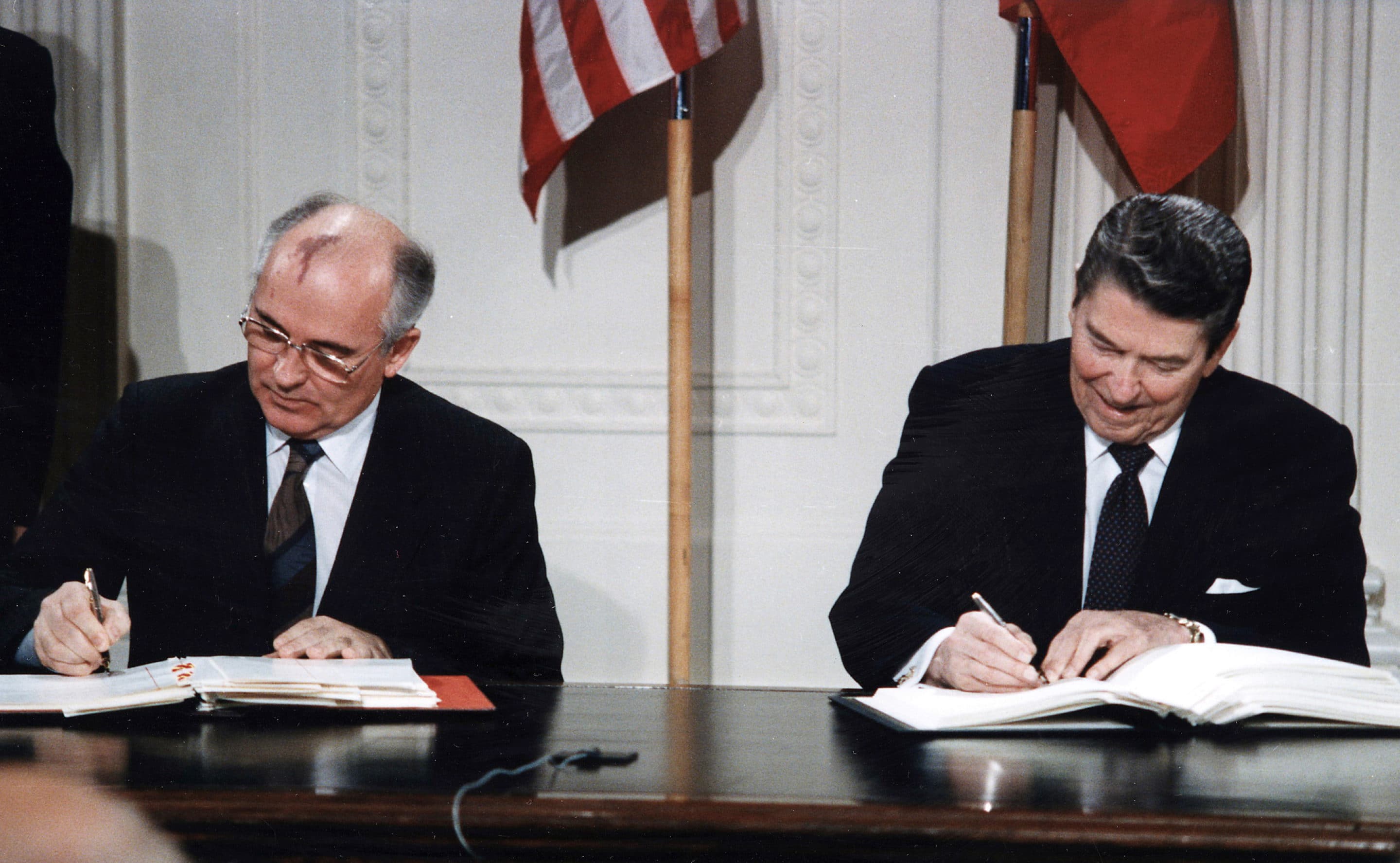 U.S. President Ronald Reagan and Soviet General Secretary Mikhail Gorbachev signing the INF Treaty in the East Room at the White House in 1987. (Photo by: Universal History Archive/UIG via Getty Images)