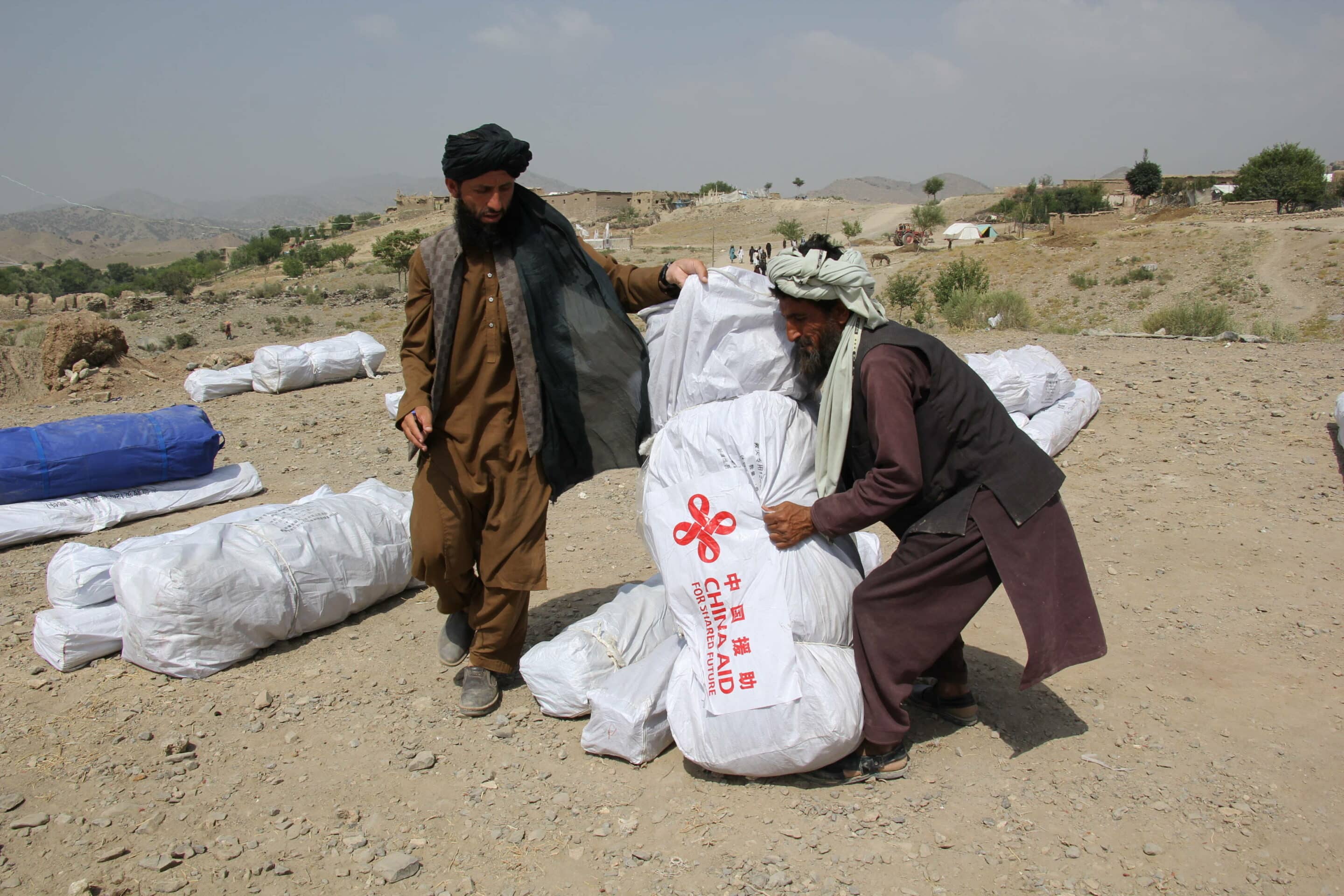 Afghan men carrying China-donated quake relief supplies in Paktika province, Afghanistan. -//CHINENOUVELLE_XxjpbeE007587_20220702_PEPFN0A001/2207021742/Credit:CHINE NOUVELLE/SIPA/2207021747