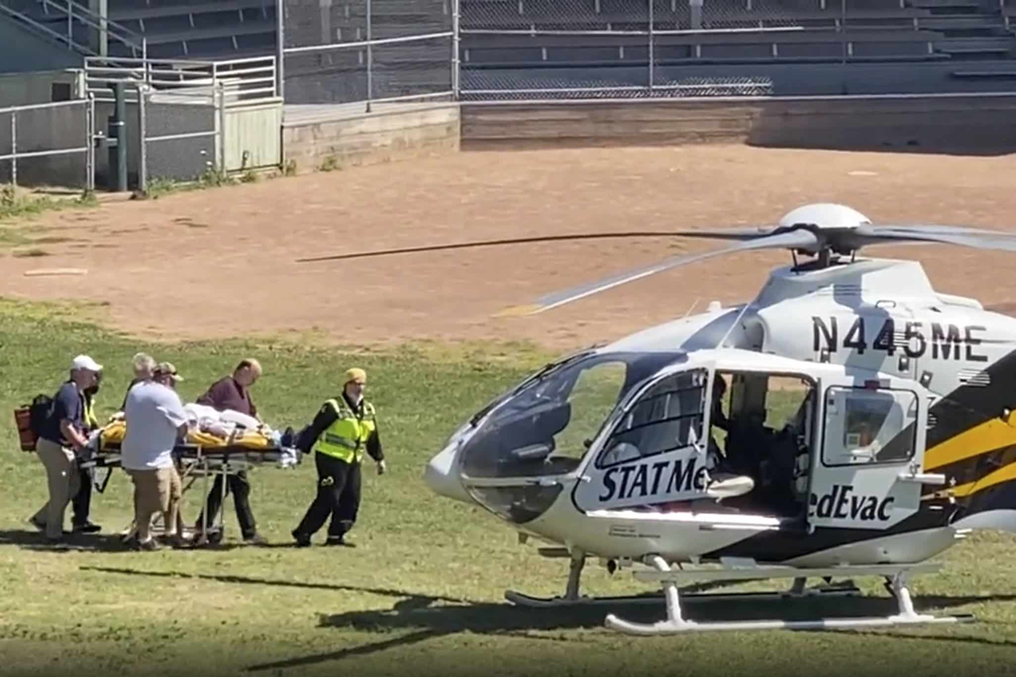 Salman Rushdie is taken on a stretcher to a helicopter for transport to a hospital after he was attacked during a lecture at the Chautauqua Institution in Chautauqua, N.Y., Friday, Aug. 12, 2022. (AP Photo)/NYAJ501/22224580016117//2208122021