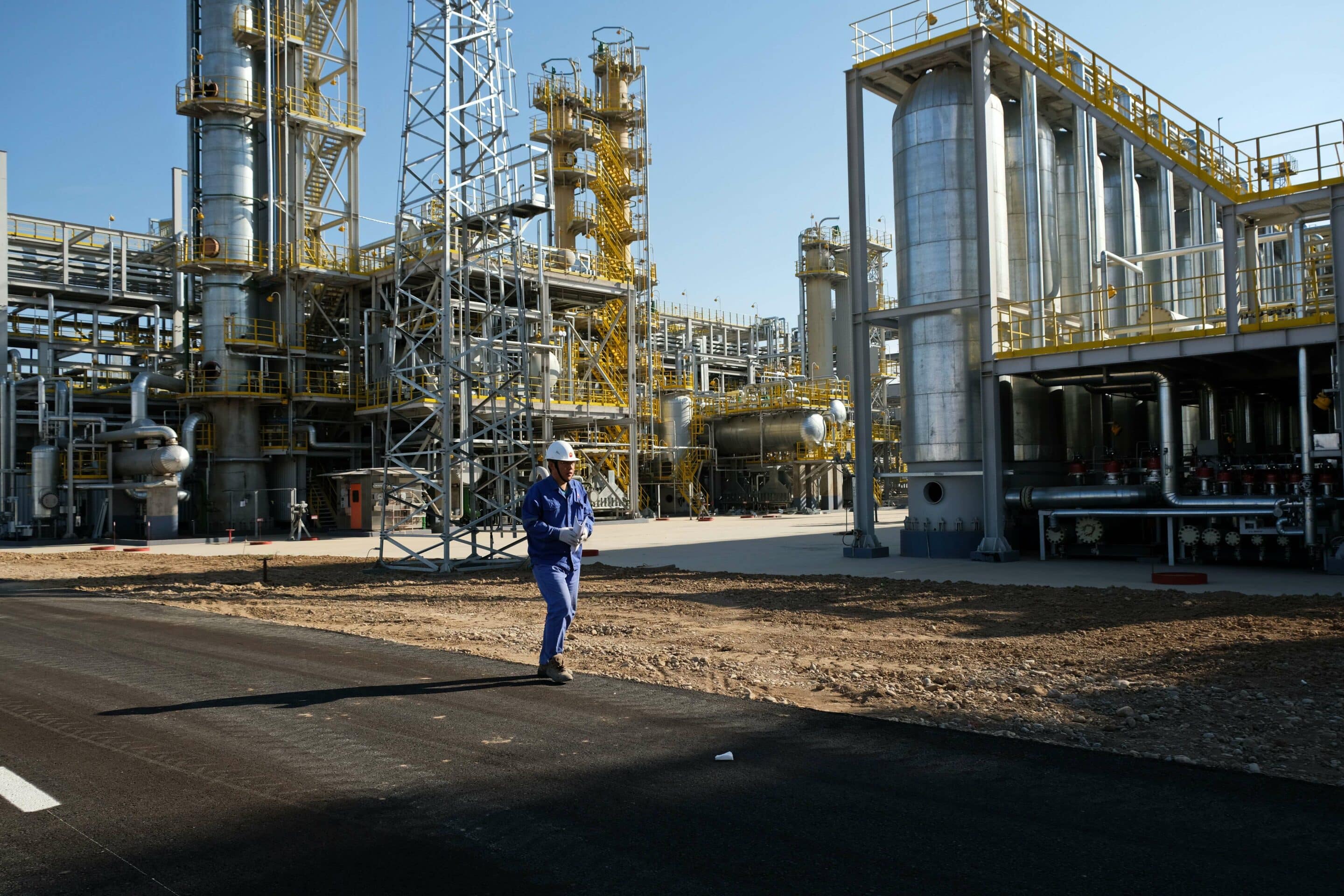 Mandatory Credit: Photo by Vladimir Tretyakov/Shutterstock (13048009f)
A worker of an oil-producing enterprise walks through the territory. P13048009f//2207260730