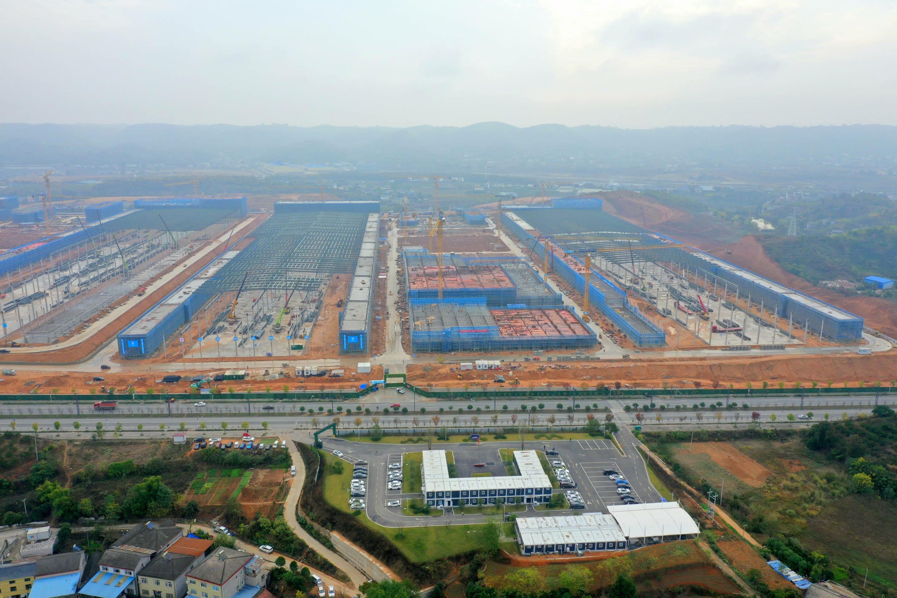 YICHANG, CHINA - NOVEMBER 23, 2022 - Aerial photo shows large engineering vehicles at the site of the Chuneng New Energy (Yichang) lithium battery Industrial Park project in Yichang, Hubei Province, China, Nov 23, 2022. It is understood that the total investment of Chuneng New Energy Source (Yichang) lithium battery Industrial Park project is 60 billion yuan, and the planned construction of 150GWh lithium battery capacity is divided into four phases, of which the first phase will build 40GWh capacity. It is expected to achieve an annual output value of 105 billion yuan, a tax revenue of 6 billion yuan, and 20,000 jobs. It will form a large-scale new energy lithium battery production base with an annual industrial output value of more than 100 billion yuan, integrating research and development, manufacturing and sales of power batteries, energy storage batteries, module packs and energy management systems. (Photo by CFOTO/Sipa USA)/42929015//2211231455