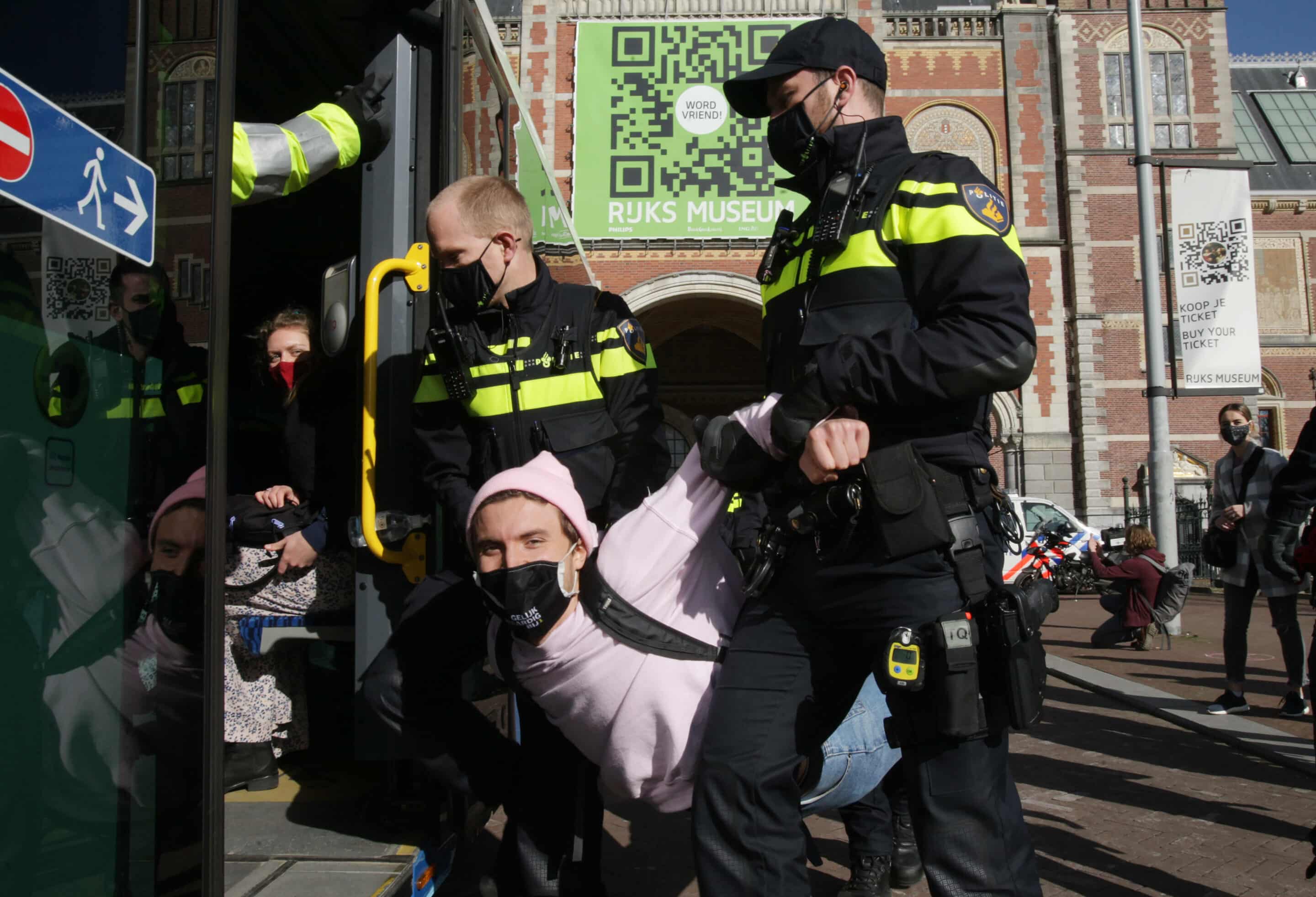 An Extinction Rebellion environmental activist is arrested by Dutch police officers during protest block the main entrance of the Rijksmuseum on February 26, 2021. (Photo by Paulo Amorim/Sipa USA)/32441888/PA/2102261540