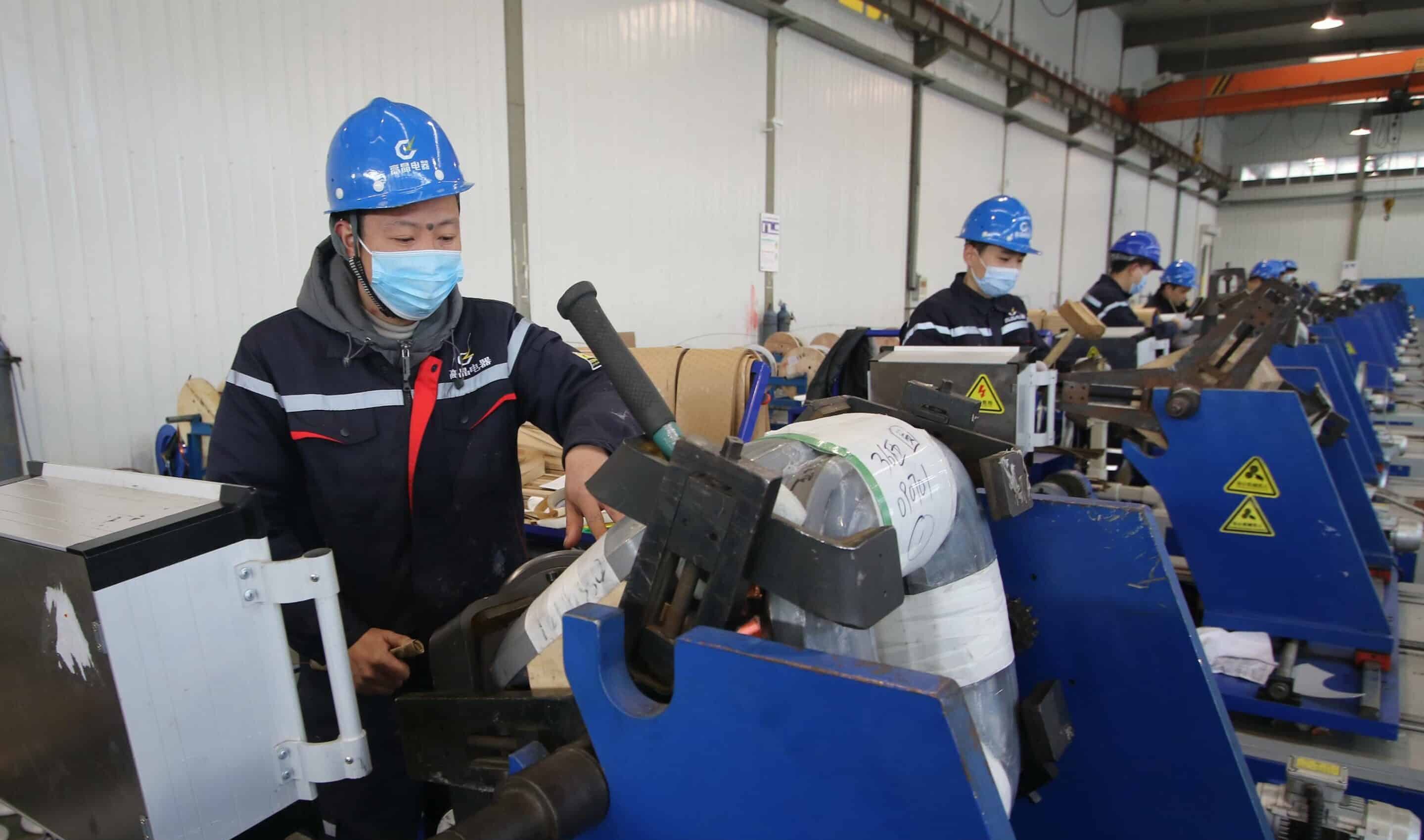HANDAN, CHINA - JANUARY 3, 2023 - Workers assemble transformers at a workshop of Hebei Gaojing Electric Equipment Co LTD in an industrial park in Handan, North China's Hebei province, Jan 3, 2023. (Photo by CFOTO/Sipa USA)/43638635//2301031150