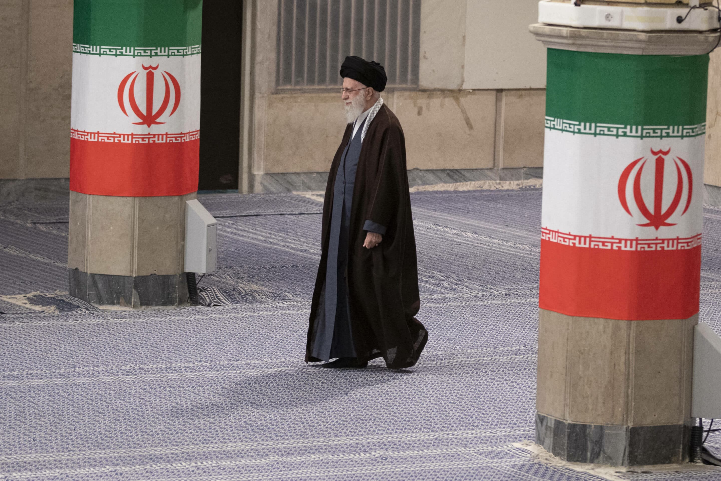 Iran's supreme leader Ayatollah Ali Khamenei walks past Iranian flags before casting his votes in the parliamentary elections and the elections for the Council of Experts on 01 March 2024, Iran, Tehran. (Photo by Sobhan Farajvan / Pacific Press) - SobhanFarajvan_030124//PACIFICPRESS_xyz00005033_000022/Credit:Sobhan Farajvan/PACIFIC PRESS/SIPA/2403011235